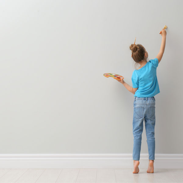 Girl painting wall 